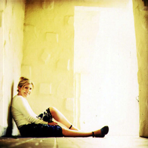 Leaning against a wall